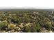 Aerial view of neighborhood showcasing tree-lined streets and homes at 1677 S Gordon Sw St, Atlanta, GA 30310