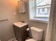 Clean bathroom with a single vanity and toilet at 1677 S Gordon Sw St, Atlanta, GA 30310