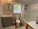 Updated bathroom with tub, vanity and toilet at 1677 S Gordon Sw St, Atlanta, GA 30310