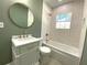 Stylish bathroom featuring a freestanding tub, updated vanity, and a statement mirror at 1677 S Gordon Sw St, Atlanta, GA 30310