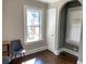 Bright bedroom with hardwood floors, large window, and neutral walls at 1677 S Gordon Sw St, Atlanta, GA 30310