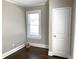 Well-lit bedroom with hardwood floors, neutral walls, and a closet at 1677 S Gordon Sw St, Atlanta, GA 30310