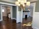 Open concept dining room with hardwood floors and fireplace view at 1677 S Gordon Sw St, Atlanta, GA 30310