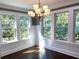 Bright dining room with hardwood floors, chandelier, and large windows at 1677 S Gordon Sw St, Atlanta, GA 30310