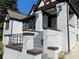 Front entrance with brick steps and ornate railing leading to the front porch at 1677 S Gordon Sw St, Atlanta, GA 30310