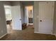 Hallway view with doors to bedrooms and a bathroom at 1677 S Gordon Sw St, Atlanta, GA 30310