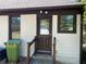 Rear exterior view showing access door and landscaping at 1677 S Gordon Sw St, Atlanta, GA 30310