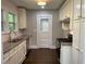 Updated kitchen with white cabinets, stainless steel appliances, and quartz countertops at 1677 S Gordon Sw St, Atlanta, GA 30310