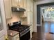 Updated kitchen with stainless steel appliances and white cabinets at 1677 S Gordon Sw St, Atlanta, GA 30310