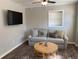 Cozy living room with sofa, coffee table and mounted TV at 1677 S Gordon Sw St, Atlanta, GA 30310