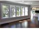Sunlit living room with hardwood floors and large windows at 1677 S Gordon Sw St, Atlanta, GA 30310