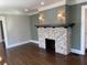 Living room with hardwood floors, fireplace, and recessed lighting at 1677 S Gordon Sw St, Atlanta, GA 30310