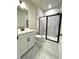 Modern bathroom featuring a glass shower and vanity at 738 Crossroad Ct, Powder Springs, GA 30127