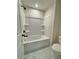 Bathroom features new fixtures, bathtub and shower combo at 738 Crossroad Ct, Powder Springs, GA 30127