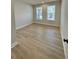 Bright bedroom featuring plank flooring and natural light at 738 Crossroad Ct, Powder Springs, GA 30127