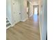 Hallway features light-colored hardwood floors and a white door to the left at 738 Crossroad Ct, Powder Springs, GA 30127