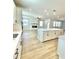 Open-concept kitchen with center island flowing into the living area at 738 Crossroad Ct, Powder Springs, GA 30127