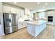 A kitchen showcasing stainless steel appliances, white cabinets, and a center island with quartz countertop at 738 Crossroad Ct, Powder Springs, GA 30127