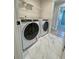 Laundry room features modern washer and dryer at 738 Crossroad Ct, Powder Springs, GA 30127