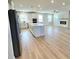 Spacious living area with kitchen island and fireplace at 738 Crossroad Ct, Powder Springs, GA 30127