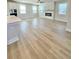 Open living room with modern fireplace and mantle at 738 Crossroad Ct, Powder Springs, GA 30127