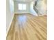 Spacious living room with a staircase and light-colored hardwood floors at 738 Crossroad Ct, Powder Springs, GA 30127
