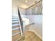 Staircase features light wood steps and dark metal railings at 738 Crossroad Ct, Powder Springs, GA 30127