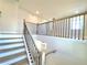 Staircase features light wood steps and dark metal railings at 738 Crossroad Ct, Powder Springs, GA 30127