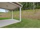 Covered patio and grassy backyard perfect for outdoor entertaining at 404 Beacon Way, Villa Rica, GA 30180