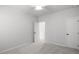Cozy bedroom with carpet flooring, a ceiling fan, and ensuite door at 404 Beacon Way, Villa Rica, GA 30180