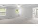 Large bedroom with carpet, two windows, ceiling fan and an ensuite bathroom at 404 Beacon Way, Villa Rica, GA 30180