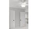 Bright bedroom featuring gray walls, plush carpet, and closet for storage at 404 Beacon Way, Villa Rica, GA 30180
