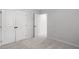 Bright bedroom featuring gray walls, plush carpet, and closets for storage at 404 Beacon Way, Villa Rica, GA 30180