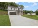 A beautiful two-story home with a long driveway, two-car garage, and a well-kept lawn at 404 Beacon Way, Villa Rica, GA 30180
