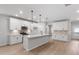 Stylish kitchen with white cabinets, quartz countertops, stainless steel appliances, and a central island at 404 Beacon Way, Villa Rica, GA 30180