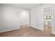 Spacious living room with light-colored wood floors and views into the kitchen area at 404 Beacon Way, Villa Rica, GA 30180