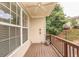 Cozy balcony area featuring wood flooring, wooden railing, and serene outdoor views at 2382 Gallard St, Lawrenceville, GA 30043