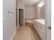 Bathroom featuring a bathtub and vanity with white cabinets at 2382 Gallard St, Lawrenceville, GA 30043