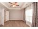 Neutral bedroom featuring a ceiling fan, carpet, and a window at 2382 Gallard St, Lawrenceville, GA 30043