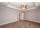 Neutral bedroom featuring a ceiling fan, carpet, and an ensuite bathroom at 2382 Gallard St, Lawrenceville, GA 30043