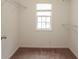 Walk-in closet with carpet and wire shelving and a window providing natural light at 2382 Gallard St, Lawrenceville, GA 30043