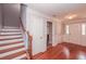 Inviting foyer with hardwood floors, staircase, and classic white trim throughout the entry and doorway at 2382 Gallard St, Lawrenceville, GA 30043