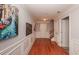 Hallway with hardwood floors, wainscoting, and decorative art pieces at 2382 Gallard St, Lawrenceville, GA 30043