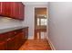 Hallway showing built-in cabinets and hardwood floors leading into a sunlit room at 2382 Gallard St, Lawrenceville, GA 30043