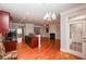 Open concept living room and kitchen with hardwood floors, fireplace, and ample natural light at 2382 Gallard St, Lawrenceville, GA 30043