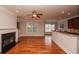 Open concept living room and kitchen with hardwood floors and fireplace at 2382 Gallard St, Lawrenceville, GA 30043