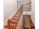 Staircase with wood treads, decorative iron railing, and neutral paint at 2382 Gallard St, Lawrenceville, GA 30043