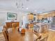 Spacious dining area with hardwood floors and a view of the kitchen at 3530 Dahlonega Hwy, Cumming, GA 30028