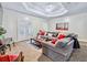 Spacious Gathering room with a large sectional sofa and access to the outdoors at 3530 Dahlonega Hwy, Cumming, GA 30028