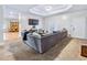 Open Gathering room with a comfortable sectional sofa and hardwood floors at 3530 Dahlonega Hwy, Cumming, GA 30028